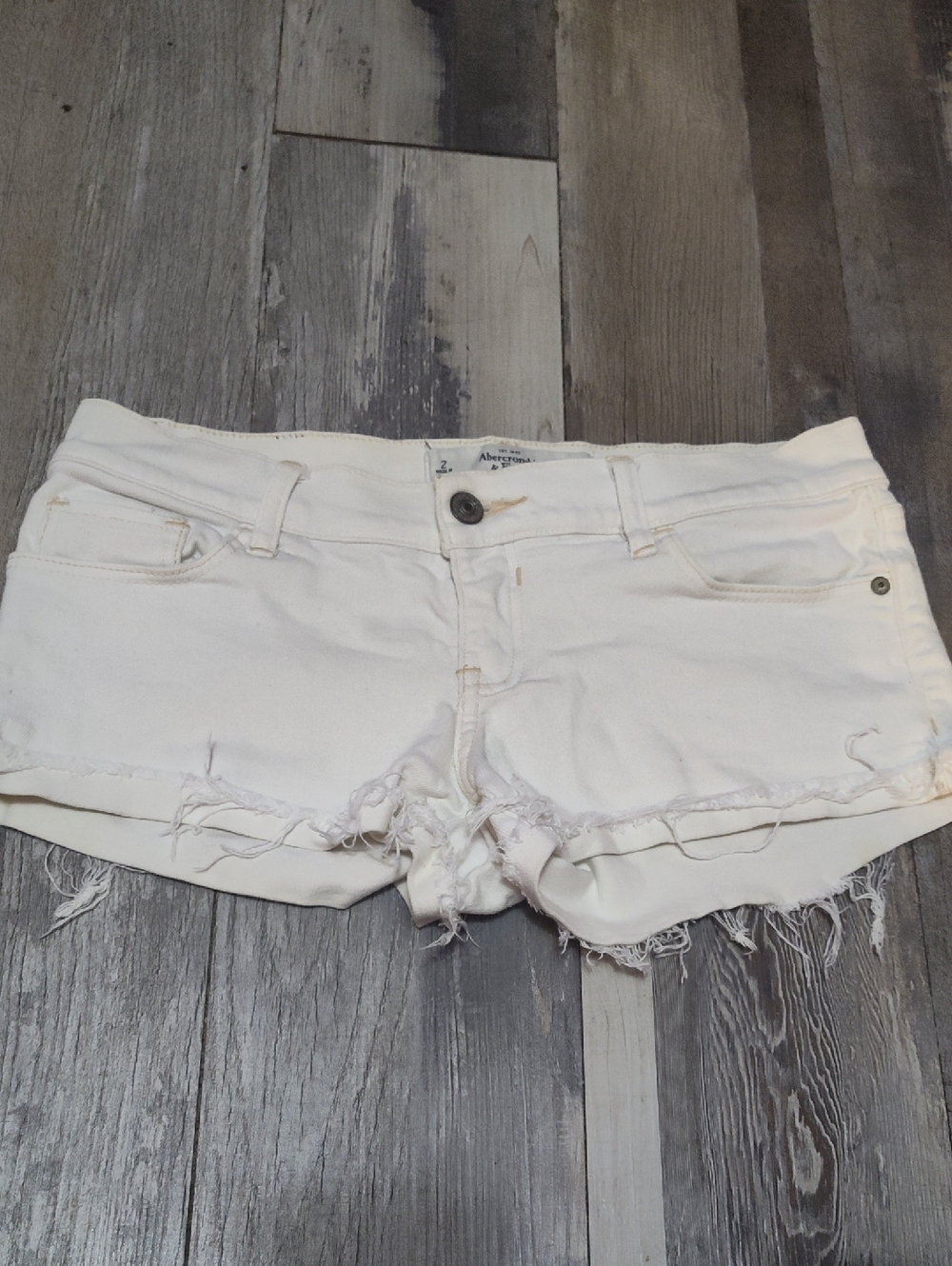 5/$25 SALE Abercrombie & Fitch Size 2 Off-White Frayed Denim Cutoff Shorts